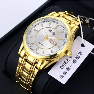 Elegant detailed view of men's gold quartz watch featuring white dial, crystal hour markers, date window.