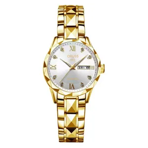 Close-up of the golden quartz watch dial featuring diamond markers, Roman numerals, and date.
