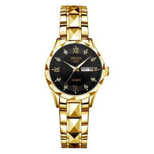 Detailed view of women gold quartz watch with black dial, diamond markers and steel strap.