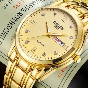 Gold quartz watch for men with calendar display, elegant diamond markers and stainless steel strap.