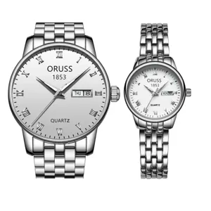 Ensemble de montres quartz couple en acier inoxydable avec chiffres romains et calendrier.