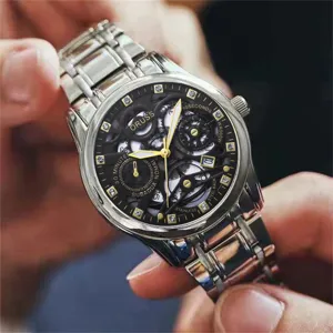 Men luxury business casual watch detail view featuring skeleton dial and steel bracelet.