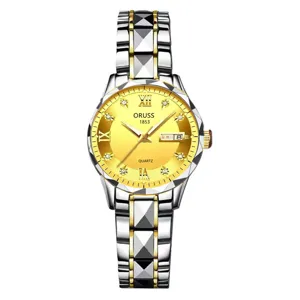 Detailed view of women quartz watch, gold dial with diamond markers, dual calendar and metal band.