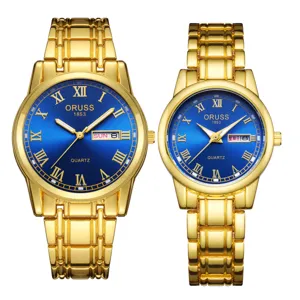 Luxus Gold Quarz Paare Uhr Set mit blauem römischen Zifferblatt Kalenderanzeige.