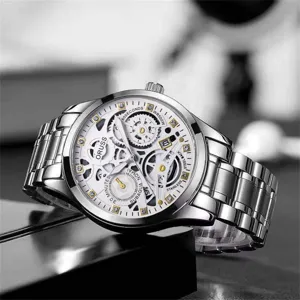 Detailed view of the stylish men quartz wristwatch with skeleton dial and metal strap.