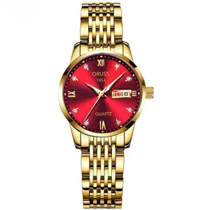 Detalle del reloj de cuarzo dorado con esfera roja brillante y práctico calendario.