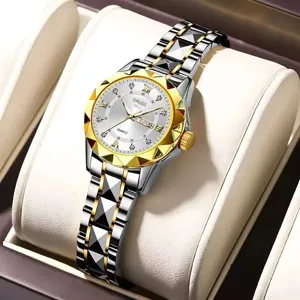 Women's fashion quartz watch with diamond-cut bezel and two-tone strap. Detail view of elegant watch.