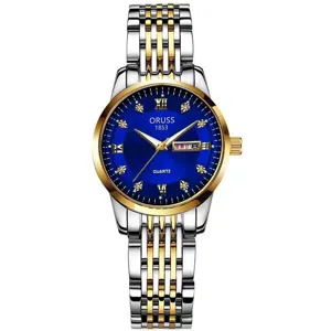 Detalle de cerca del reloj de cuarzo bicolor para mujer con una esfera azul muy elegante.