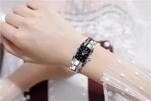 Elegant women quartz watch with metallic steel strap and classic black dial for daily wear.