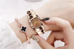 Detailed view of the women's square quartz watch with rose gold stainless steel strap.