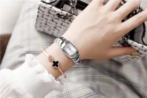 Fashion women quartz watch with elegant steel bracelet and detail view of wrist wear styling.