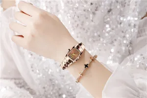 Exquisite women's square quartz watch with coffee dial and rose gold steel strap detail.