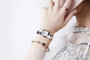 Elegant women's quartz watch featuring a stylish metal strap and sleek dial for daily fashion wear.