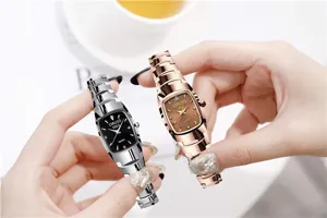 Detail view of stylish geometric quartz women watches with metallic steel bands and clear dials.