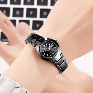 Elegant black quartz watch for women with metal bracelet, calendar display and clear dial.