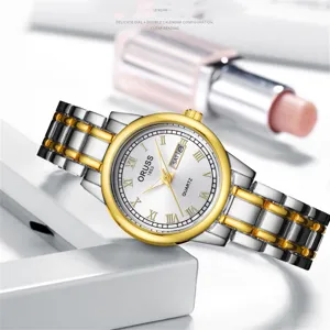 Montre quartz femme bracelet metal bicolore chiffres romains calendrier elegante mode