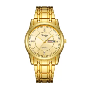 Detailed close-up of gold tone quartz watch with crystal hour markers and day-date display.