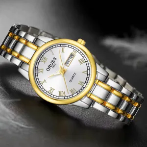 Élégante montre quartz pour femme avec double calendrier chiffres romains et bracelet métal.