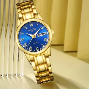 Montre quartz élégante pour femme avec bracelet en métal doré, cadran bleu et affichage du calendrier.