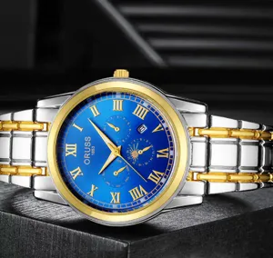 Men's quartz watch detail shot featuring a striking blue dial with gold Roman numerals.