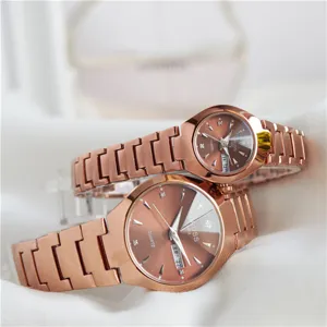 Elegant luxury rose gold couple quartz wristwatches with stylish brown dial and steel strap.