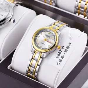 Elegant women two-tone quartz watch with round dial, metal strap and date display.