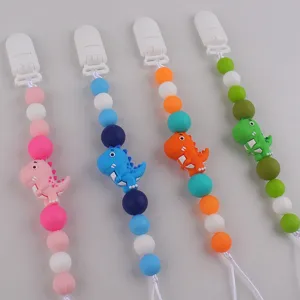 Silicone dinosaur pacifier clip detail view, colorful teething beads baby anti-drop chain.