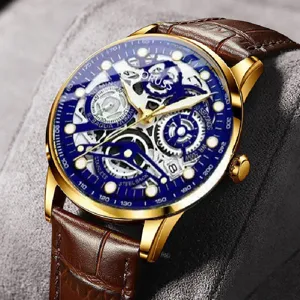 Men's automatic skeleton watch with gold case, brown leather strap and blue dial.