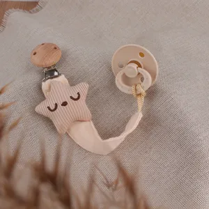 Cute star pacifier clip set with soothing pacifier, soft fabric and natural wood details.