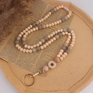 Holz und Silikon Perlen Lanyard Detail mit einer süßen Gänseblümchen Blume und Metallschnalle