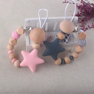 Silicone star and wooden bead baby pacifier chain detail, safe teether clip for newborns.