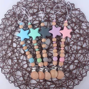 Silicone star baby pacifier clips with natural wooden beads and teething toys for infants.