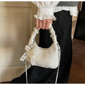 White pleated hobo shoulder bag with chain strap and pearl lace pendant for women fashion.