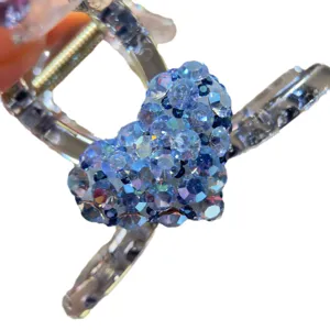 Blue rhinestone heart hair claw clip, medium size shark clip for elegant women styling.