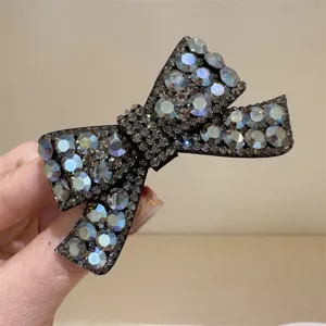 Pince à cheveux nœud strass scintillant pour femme, élégante barrette cristal noire.