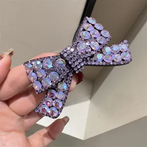 Pince à cheveux nœud strass violet scintillant pour femme, barrette élégante, accessoire mode.