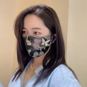 Fashion rhinestone butterfly embroidered mask detail showcasing stylish dustproof accessory design.
