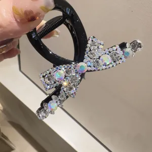 Pince à cheveux nœud en cristal noir, accessoire de coiffure en strass pour femmes élégantes.