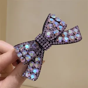 Superbe pince à cheveux nœud strass violet, barrette cristaux scintillants pour coiffures élégantes.