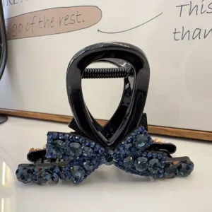 Pince à cheveux noire avec strass bleu foncé design nœud pour coiffure élégante et quotidienne