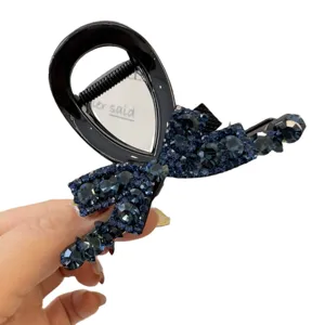 Élégante pince à cheveux nœud strass pour femmes, accessoire coiffure cristal bleu foncé.