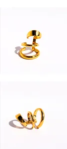 Detail shot of gold multi-layer spiral ear cuff, stylish metal geometric non-pierced jewelry piece.