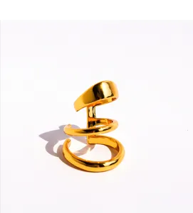Close-up of a stylish multi-layer spiral gold ear cuff, featuring a glossy metallic finish.