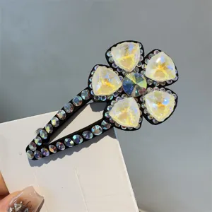 Barrette a cheveux fleur en cristal avec strass scintillants, pince latérale élégante.