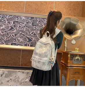 Zaino casual con stampa cielo stellato per donna, borsa grande con grazioso ciondolo orsetto.