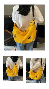 Large capacity canvas crossbody shoulder bag for women, casual trendy messenger bag in bright yellow.