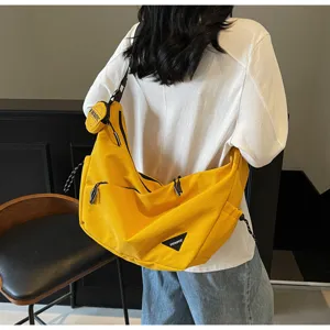 Casual large capacity yellow canvas messenger bag for women, stylish crossbody shoulder bag.