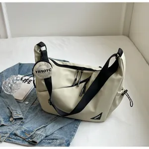 Casual beige shoulder bag with coin pouch, large capacity crossbody bag for daily use.