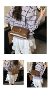 Detailed view of the brown PU leather shoulder bag showcasing its metallic turn-lock closure.