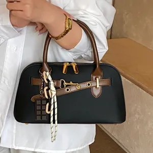 Stylish black brown women handbag with chic charm chain design for daily casual chic wear.